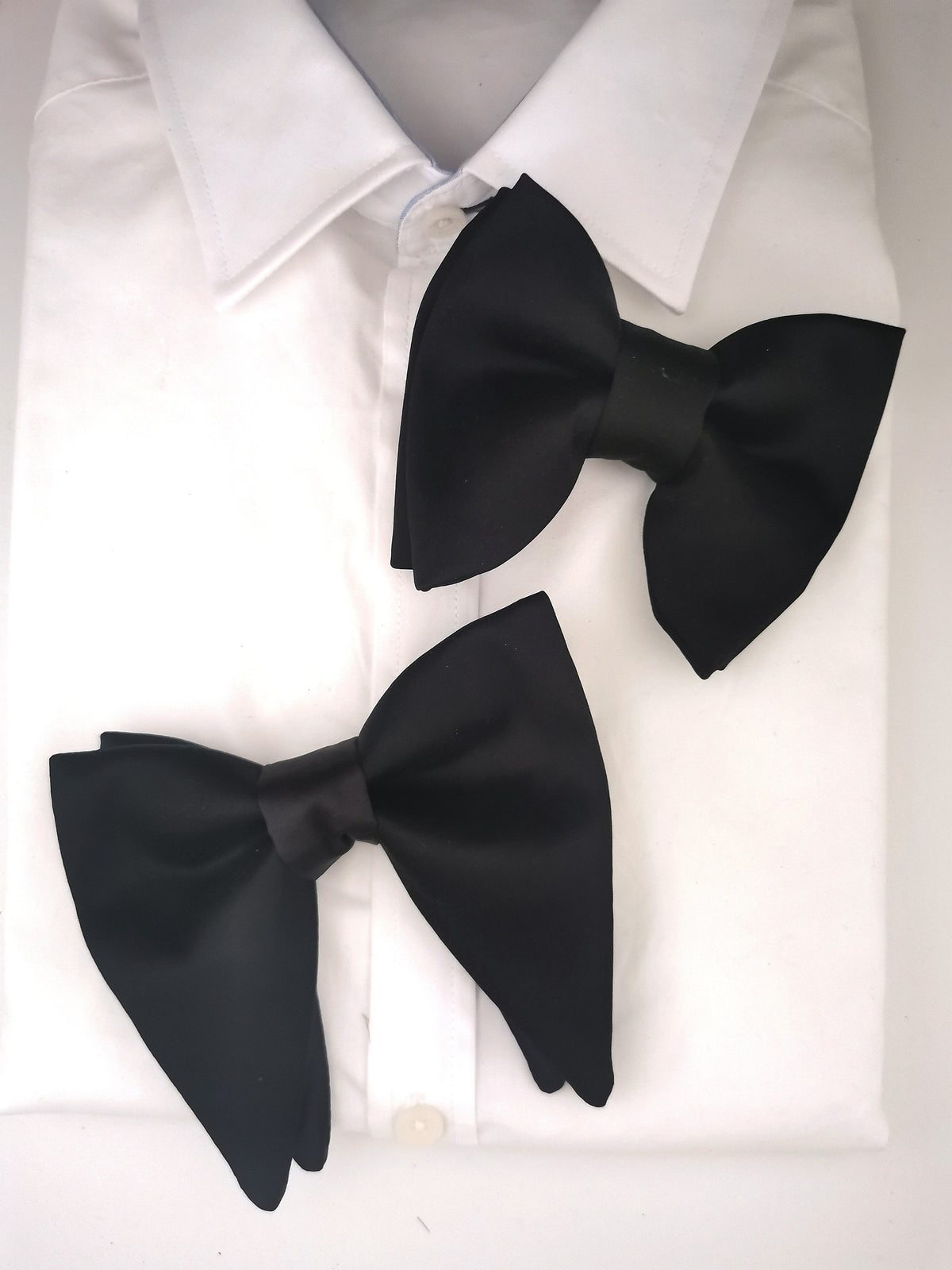 black dress shirt black bow tie Savouring the Black Tuxedos on black shirt and bow tie. Showing you how it's done for your end of the year parties, dinners, weddings and others. Offline Stores LEKKI: Banex Mall, Lekki